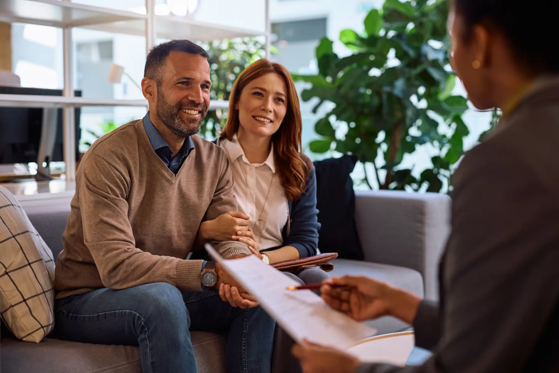 happy couple meets with financial advisor meeting in Sparta New Jersey